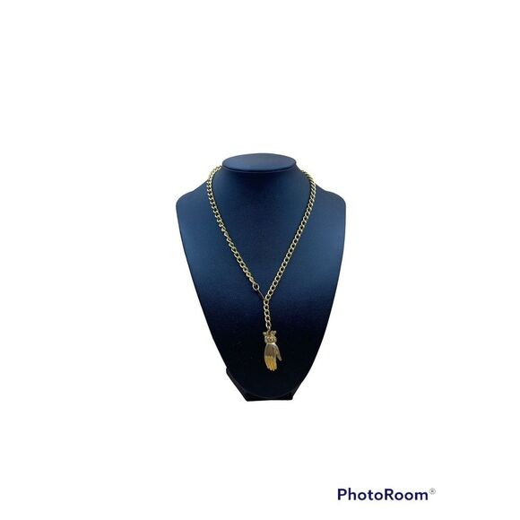 Unique theater hand wacky necklace gold tone